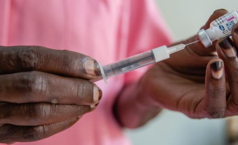 Nurse Margaret gives an injection to a client at Kawala Health Center IV in Uganda - Action Aid report